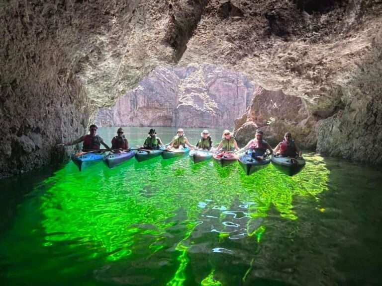 Eight Kayakers posing on their Emerald Cave Kayak Tour with Veteran Kayaks near las vegas.